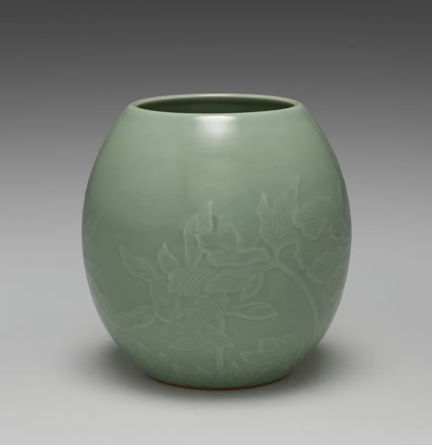 Seifū Yohei III, Water Container with Peonies, 1900 to 1914, porcelain with molded and carved design and green glaze. Cleveland Museum of Art. Technical traditions carried by workshops often outlast the institutions around them.